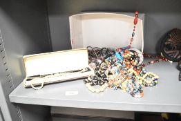 A collection of costume jewellery, including beaded necklaces, faux pearls and statement pieces