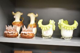 A pair of Victorian type cased opaque glass vases, with crimped and folded rims and applied and