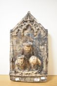 A wall plaque in the Gothic style depicting three monks, h51cm