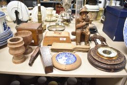 A selection of Victorian and later treen items including butter pats, tea caddy and barometer