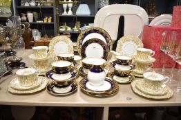 A Wedgwood fine bone china tea service having gilt handles and edges, to include cream jug, sugar