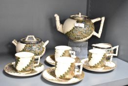 A Doulton ware tea service having ba,boo style handle, painted mark no 'A112' to reverse, comprising