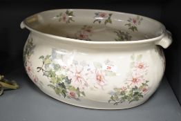 A large iron stone ceramic planter decorated with floral patterns, L44cm