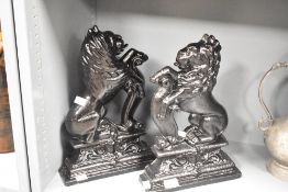 A pair of black lion door porters, h37cm