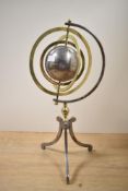 A 20th century brass and steel Armillary sphere, the central steel globe of two hemispheres with 3