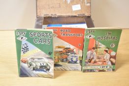 A collection of vintage I-SPY news chronicle booklets, various housed in a stitched card case