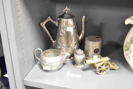 A polished pewter coffee pot in the Art Nouveau style, h22.5cm, sold together with a brass canon