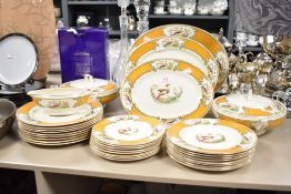 A Royal Myotts Crown Staffordshire 'Chelsea Bird' pattern dinner service, decorated with exotic bird