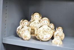 A nest of Russian dolls, largest h15.5cm