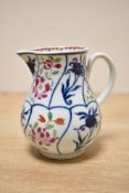 A 18th century Chinese cream jug decorated with floral patterns, h8.2cm