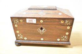 A 19th century rosewood tea caddy of sarcophagus form, supported on bun feet, decorated with pearl