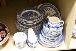 An assortment of blue and white ware to include plates, bowls and gravy boat etc.