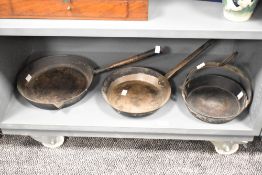 An early 20th century metal pan, w26cm, sold together with 2 others
