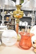 A late 19th or early 20th Century oil lamp having brass and copper base with glass chimney ,