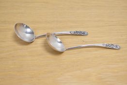 A pair of Arts & Crafts sauce spoons, having wire decoration to the terminals, marks for Edinburgh