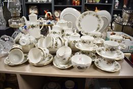 A large Royal Doulton 'Larchmont' pattern fine china tea service, to include tea/coffee pots,