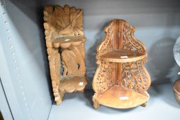 A small decorative carved oak two-tier corner shelf, carved with foliage and birds 47cm sold along