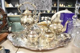 A selection of vintage plated wares including spirit kettle and large tray