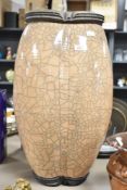 A vintage vase of crackle glaze design having peach ground, indistinctly signed to base , height