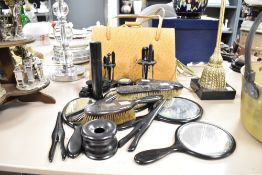 A quantity of ebony brushes and mirrors ect