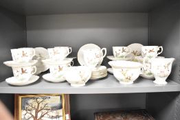 A Crown Staffordshire fine bone china 'Game Birds' pattern tea set with ten cups and saucers, 39