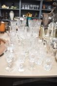 A selection of cut glass including vases and assorted drinking glasses