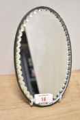 An early 20th century oval mirror, h20cm