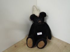 Vintage Bear, hand stitched black plush jointed bear with stitched nose and mouth , plastic eyes,