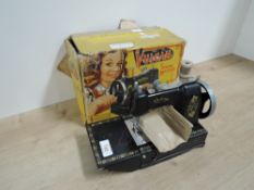 Vulcan Childs Sewing Machine with needle, cotton and clamp envelope present in original box, box