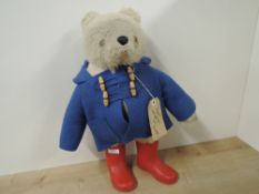 Gabrielle Bears Paddington Bear, label and luggage label present, wearing original blue coat and red