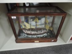 Model Boat in glass and wooden Case, named Revenge Plymouth 1577, case dimensions 51cm, 24cm, 38cm