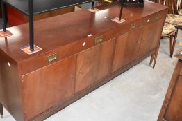 A 1970's/80's Greaves & Thomas mahogany sideboard, having two frieze drawers and four cupboard