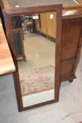 A vintage teak full length wall mirror, approx. 94 x 41cm