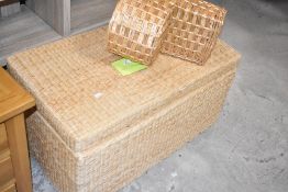 A modern rattan bedding box, width approx. 89cm and wicker 'stair' basket