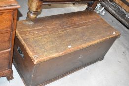 A Victorian pine blanket box, of traditional design with iron carrying handles and internal candle
