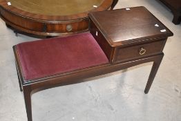 A Stag telephone seat, width approx. 92cm