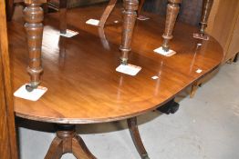 A nice quality Regency style mahogany extending dining table