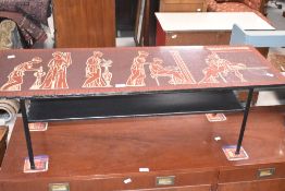 A 1960's laminate coffee table, of oblong form decorated with Neo Classical figures and repeating