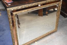 A modern gilt framed wall mirror, with copper glass border, approx. 110 x 80cm