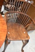 A 19th Century Windsor style carver chair having shaped shoulder rail, on cabriole legs with H
