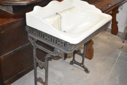 A ceramic sink on metal frame, width approx. 69cm