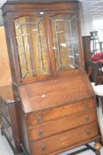 An early 20th Century oak bureau bookcase, height approx. 191cm