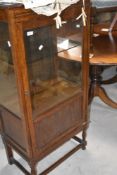 An early 20th Century oak dsiplay cabinet, approx height 125cm