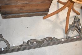 An Antique brass ornate fire fender, internal dimensions approx. 120 x 29cm