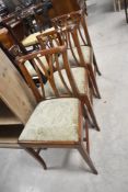 A set of three early to mid 20th Century having drop in overstuffed seats