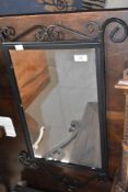 A modern metalwork wall mirror, approx. 70 x 45cm