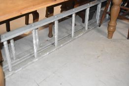 A set of aluminium extending ladders