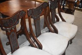 A set if late Victorian salon style dining chairs having overstuffed seats , in need of upholstery