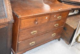 A19th century oak chest of drawers, with 2/2 arrangement of cockbeaded drawers three having