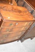 An early 20th Century mahogany and walnut bow fronted chest of four long drawers, width approx.